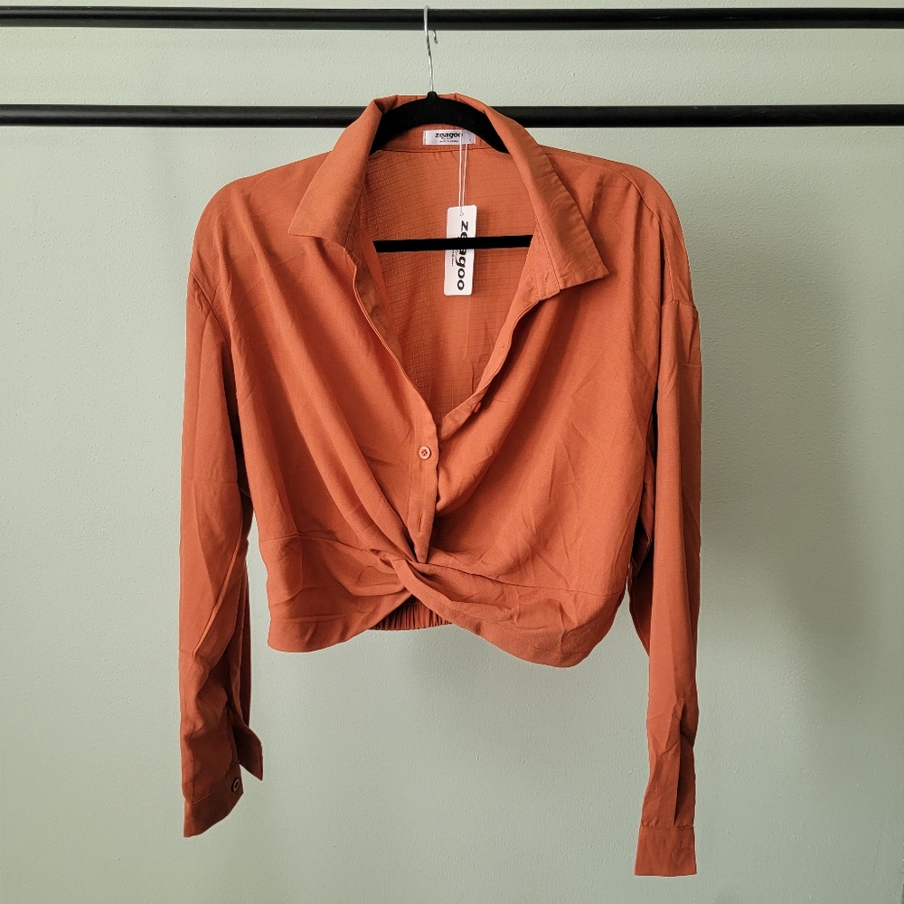Long leave burnt orange cropped button up with twist bottom